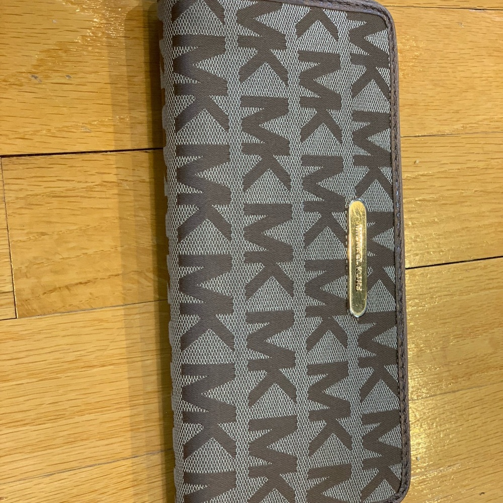 Michael Kors brown and gold wallet.